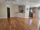 Spacious living room with hardwood floors and open kitchen view at 14902 Arrena Rd, Winter Garden, FL 34787