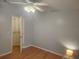 Bedroom with hardwood floors, walk-in closet, and light blue walls at 14902 Arrena Rd, Winter Garden, FL 34787