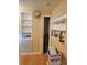 Hallway with built-in shelving and hardwood floors at 14902 Arrena Rd, Winter Garden, FL 34787