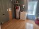 Laundry room with water heater and utility sink at 14902 Arrena Rd, Winter Garden, FL 34787