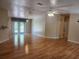 Open living area with hardwood floors and access to a patio at 14902 Arrena Rd, Winter Garden, FL 34787