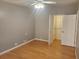 Bright bedroom featuring hardwood floors and a walk-in closet at 14902 Arrena Rd, Winter Garden, FL 34787