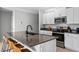 Modern kitchen with stainless steel appliances and granite countertops at 3519 Lounging Wren Ln, Bartow, FL 33830