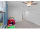 bedroom with a play table, tent, and ample closet space at 3519 Lounging Wren Ln, Bartow, FL 33830