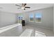 Bright and airy living room with tile floors and backyard access at 3519 Lounging Wren Ln, Bartow, FL 33830