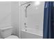 Bathroom with a shower/tub combination and blue shower curtain at 3519 Lounging Wren Ln, Bartow, FL 33830