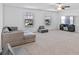 Spacious bonus room with sectional sofa and TV at 3519 Lounging Wren Ln, Bartow, FL 33830