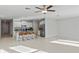 Spacious living room with tile flooring and lots of natural light at 3519 Lounging Wren Ln, Bartow, FL 33830