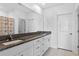 Modern bathroom with granite countertops and double vanity at 3519 Lounging Wren Ln, Bartow, FL 33830