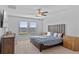 Main bedroom with a king-size bed and wood dresser at 3519 Lounging Wren Ln, Bartow, FL 33830