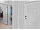 Light and airy entryway with tile floors and access to bathroom and bedroom at 3519 Lounging Wren Ln, Bartow, FL 33830