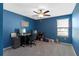 Home office with a desk, chair, and built-in shelving at 3519 Lounging Wren Ln, Bartow, FL 33830
