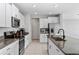 Modern kitchen with stainless steel appliances and granite countertops at 3519 Lounging Wren Ln, Bartow, FL 33830