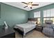 Cozy bedroom with a double bed and a relaxing armchair at 3519 Lounging Wren Ln, Bartow, FL 33830