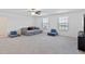 Spacious bonus room with sectional sofa and TV at 3519 Lounging Wren Ln, Bartow, FL 33830