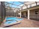 Relaxing screened-in pool and spa with brick patio at 4625 Target Blvd, Kissimmee, FL 34746