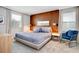 Spacious bedroom with a king-size bed and wood accent wall at 4625 Target Blvd, Kissimmee, FL 34746