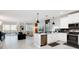 Open concept kitchen with modern appliances, island, and breakfast bar at 4625 Target Blvd, Kissimmee, FL 34746