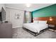 Bedroom with king-size bed and wood accent wall at 4625 Target Blvd, Kissimmee, FL 34746