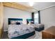 Bedroom with two twin beds and wood accent ceiling at 4625 Target Blvd, Kissimmee, FL 34746