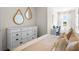 Bedroom with a dresser and large mirror at 2224 Tongass Bnd, Davenport, FL 33837