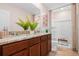 Bathroom with granite countertop double vanity and shower at 2224 Tongass Bnd, Davenport, FL 33837