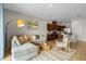 Open living room featuring a sectional sofa and views into the kitchen area at 2224 Tongass Bnd, Davenport, FL 33837