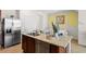 Kitchen island with granite countertop, double sink, and dishwasher at 2224 Tongass Bnd, Davenport, FL 33837