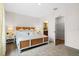 Bright bedroom featuring a king-size bed and walk-in closet at 2224 Tongass Bnd, Davenport, FL 33837