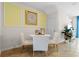 Small breakfast nook with round table and chairs, situated near an accent wall at 2224 Tongass Bnd, Davenport, FL 33837
