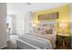 Bedroom with white bed frame and yellow accent wall at 2224 Tongass Bnd, Davenport, FL 33837
