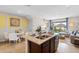 Open concept kitchen and Gathering room with island and breakfast bar at 2224 Tongass Bnd, Davenport, FL 33837