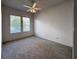 Bright bedroom with carpet flooring and ceiling fan at 24023 Robinwood St, Leesburg, FL 34748