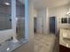 Bathroom with double vanity, large walk-in shower, and separate soaking tub at 24023 Robinwood St, Leesburg, FL 34748