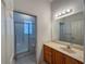 Bathroom with single vanity and shower/tub combo at 24023 Robinwood St, Leesburg, FL 34748