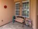 Small front porch with a bench and decorative items at 24023 Robinwood St, Leesburg, FL 34748