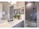 Clean bathroom with gray tile and a bathtub at 1604 Evening Summit Cir, Minneola, FL 34715