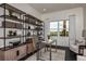 Spacious home office with large window and built-in shelving at 1604 Evening Summit Cir, Minneola, FL 34715