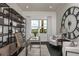Bright home office with built-in shelving and large window at 1604 Evening Summit Cir, Minneola, FL 34715