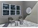 Relaxing outdoor patio with stylish seating and wall art at 1604 Evening Summit Cir, Minneola, FL 34715