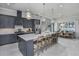 Modern kitchen with large island and stainless steel appliances at 1604 Evening Summit Cir, Minneola, FL 34715