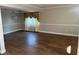 Bright dining room featuring hardwood floors and elegant window treatments at 2722 Coventry Ln, Ocoee, FL 34761