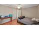Bright bedroom with wood floors and ceiling fan at 938 Framlingham Ct # 102, Lake Mary, FL 32746