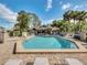 Inviting community pool with ample lounge chairs at 938 Framlingham Ct # 102, Lake Mary, FL 32746