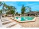 Relaxing pool area with patio furniture and clubhouse at 938 Framlingham Ct # 102, Lake Mary, FL 32746