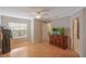 Well-lit bedroom with wood floors and dresser at 938 Framlingham Ct # 102, Lake Mary, FL 32746
