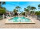 Community pool with lounge chairs and surrounding landscaping at 938 Framlingham Ct # 102, Lake Mary, FL 32746