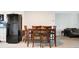 Kitchen breakfast bar with four barstools and hardwood floors at 1000 Lake Of The Woods Blvd # A204, Fern Park, FL 32730