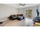 Relaxing living room with a sectional sofa, sliding doors to a patio and hardwood floors at 1000 Lake Of The Woods Blvd # A204, Fern Park, FL 32730