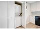 Stackable washer and dryer in a closet with louvered doors at 1000 Lake Of The Woods Blvd # A204, Fern Park, FL 32730